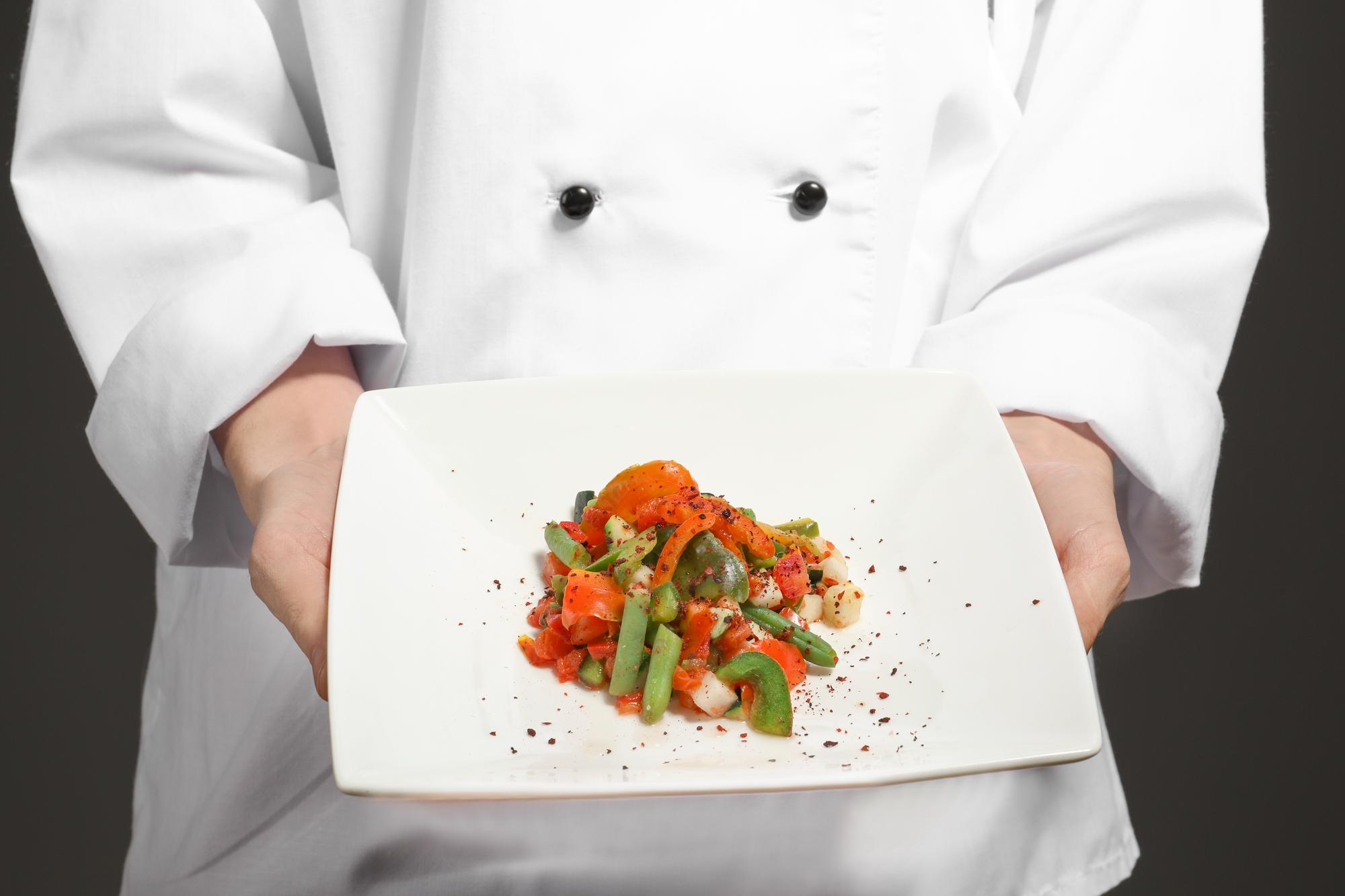 Chef presenting plated dish
